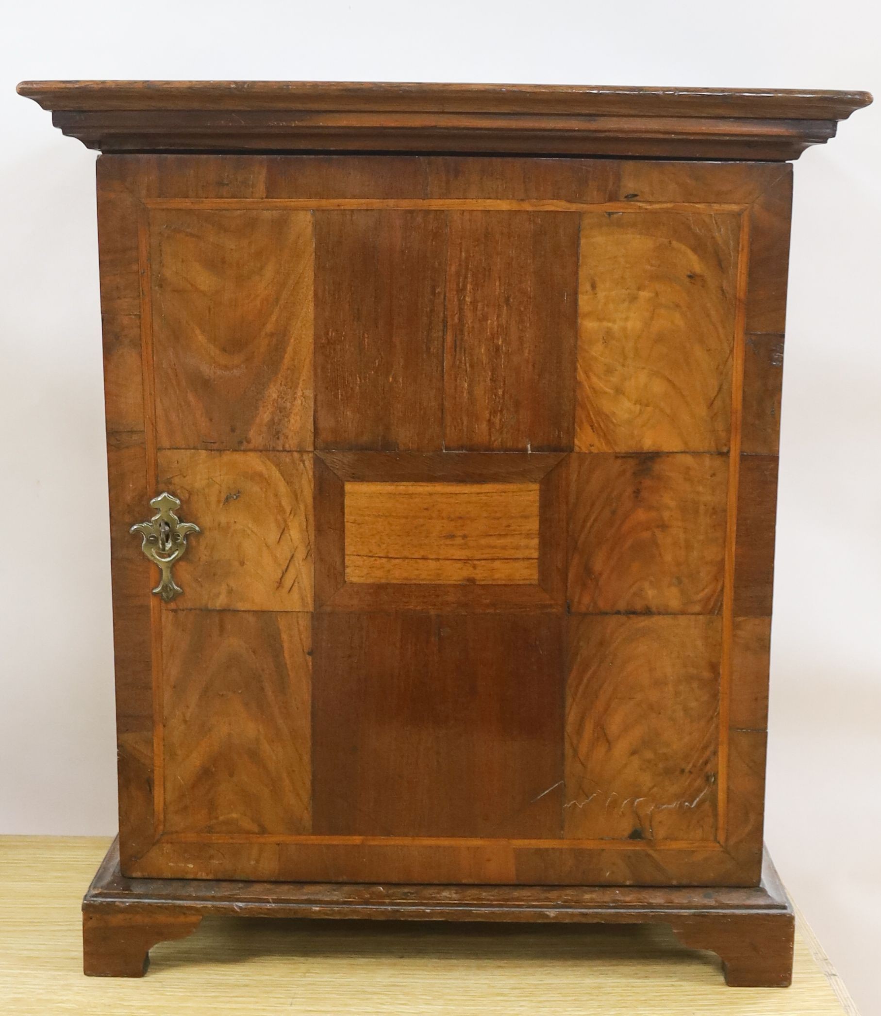An 18th century and later walnut and oak cabinet of drawers 52cm